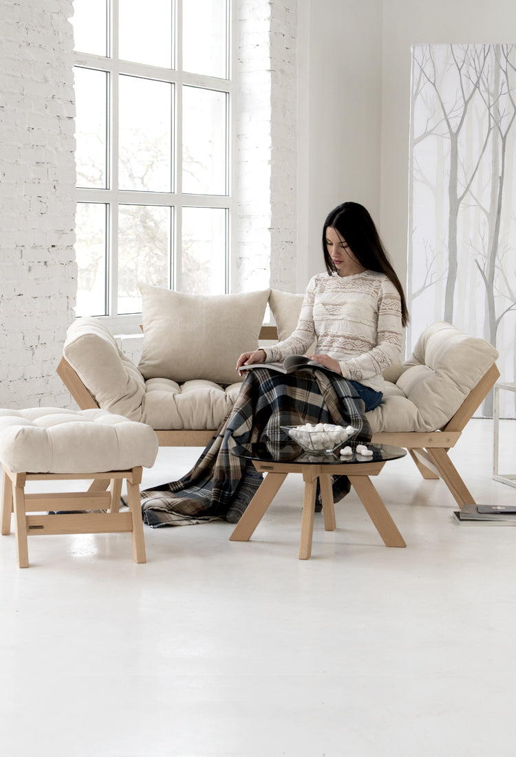 Диван-футон Allegro зі столиком та пуфом в інтер'єрі