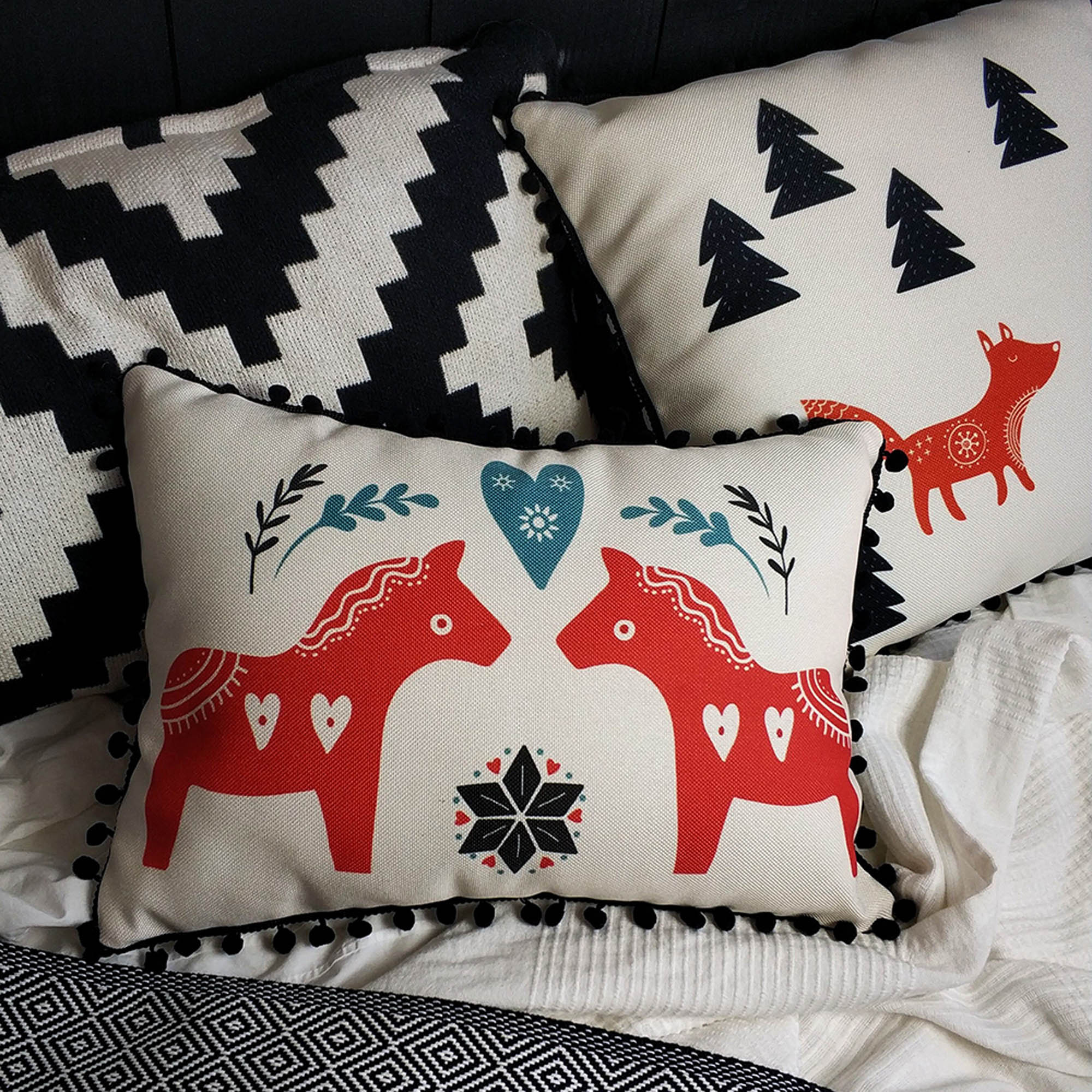 Подушка декоративна з помпонами КОНИКИ